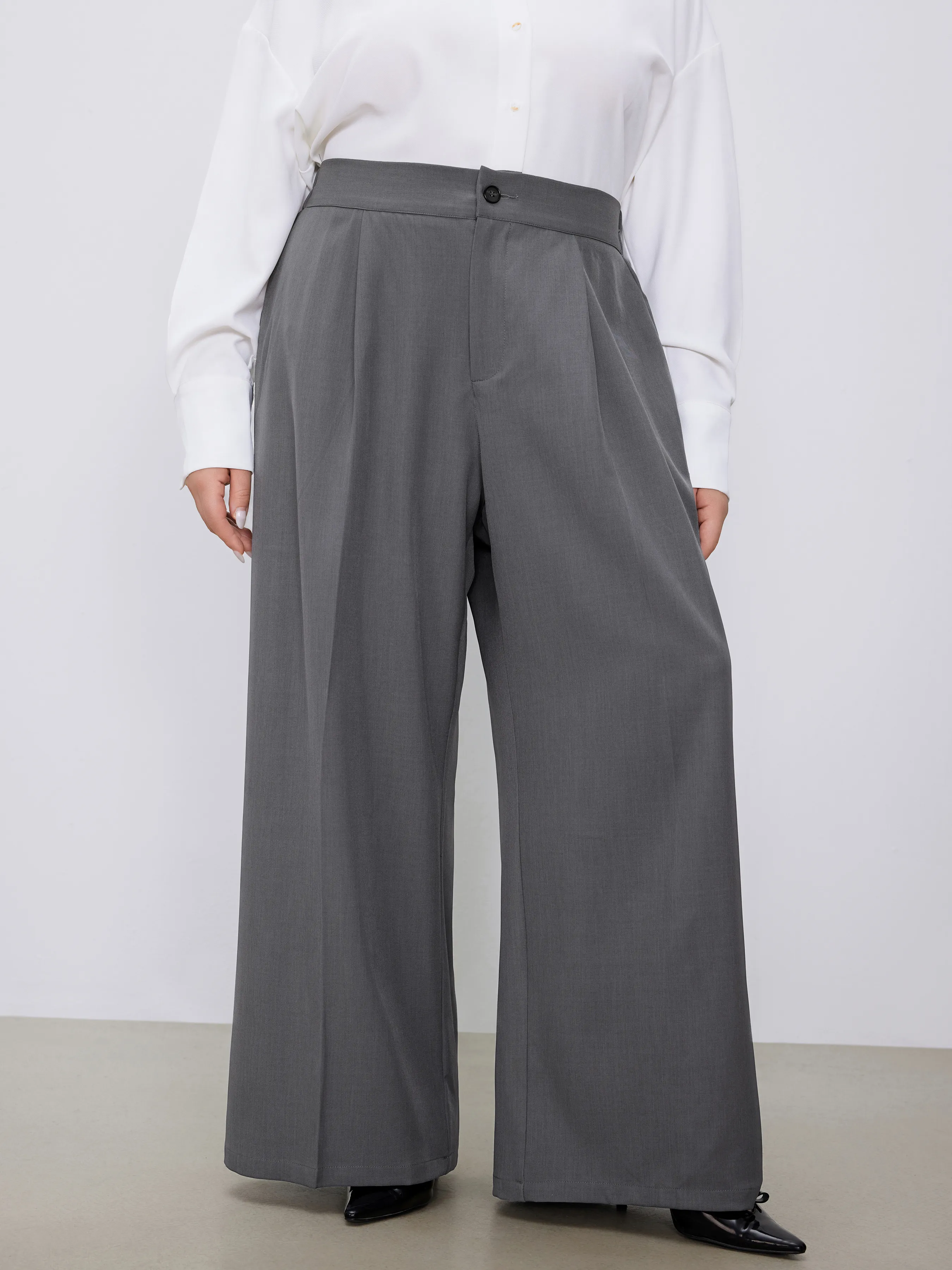 Pantalón tejido de tiro medio sólido con bolsillos y pliegues pierna recta Curvy