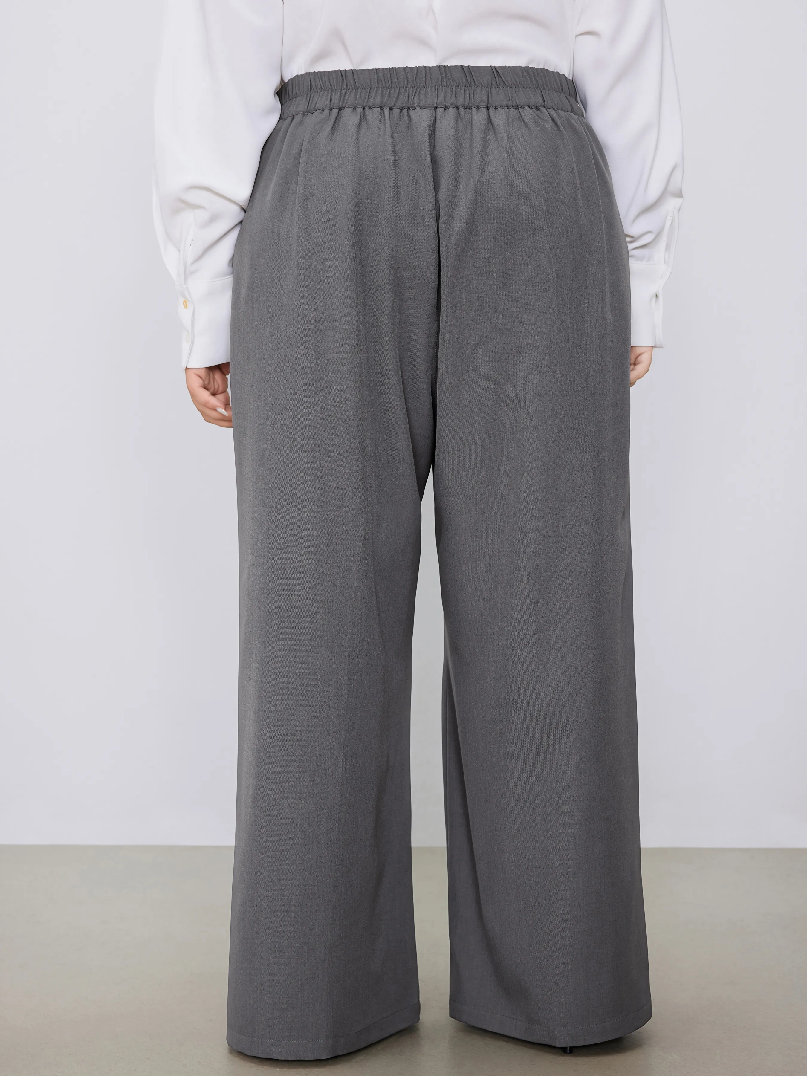 Pantalón tejido de tiro medio sólido con bolsillos y pliegues pierna recta Curvy